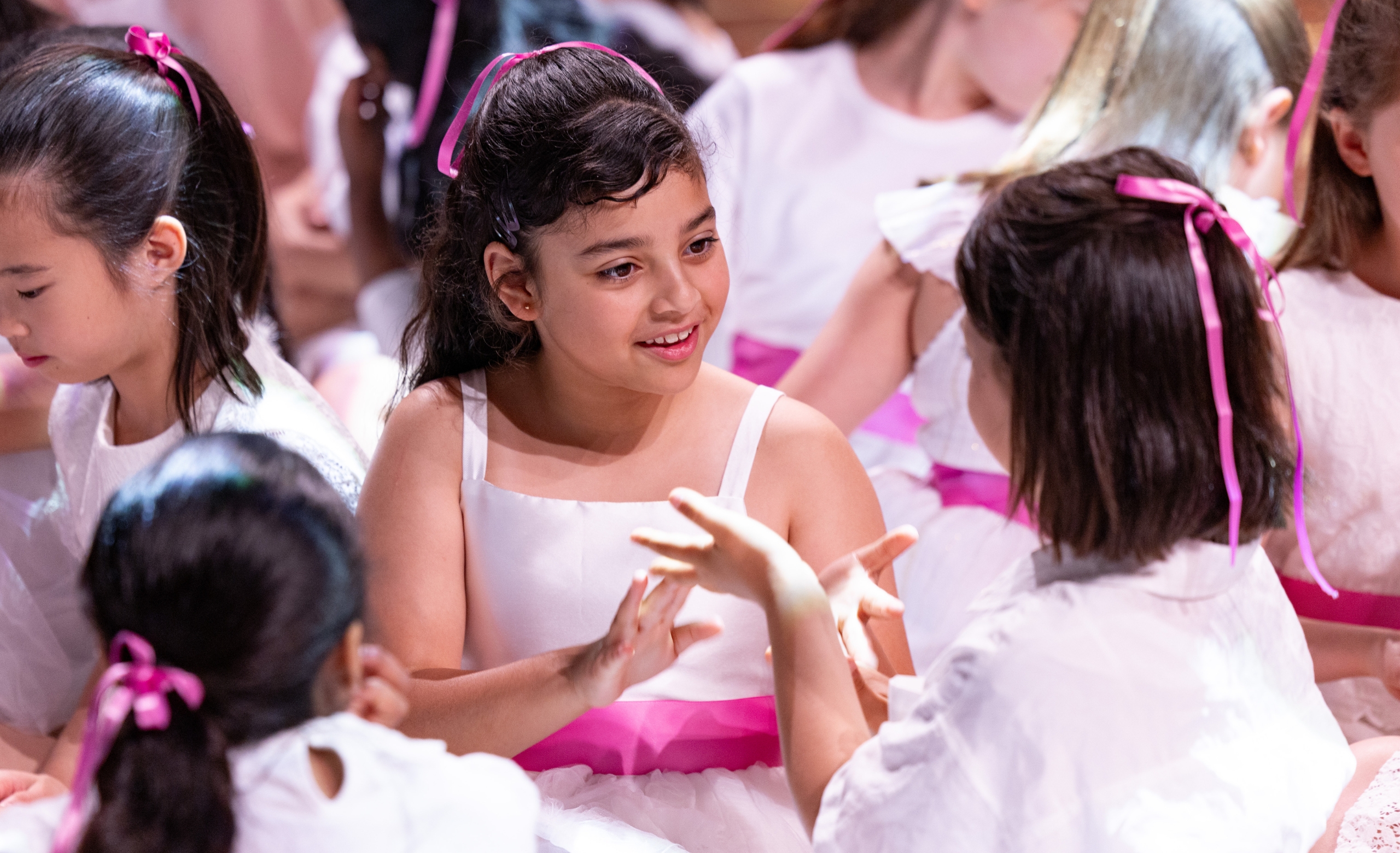 two IGC choristers play a game together on stage